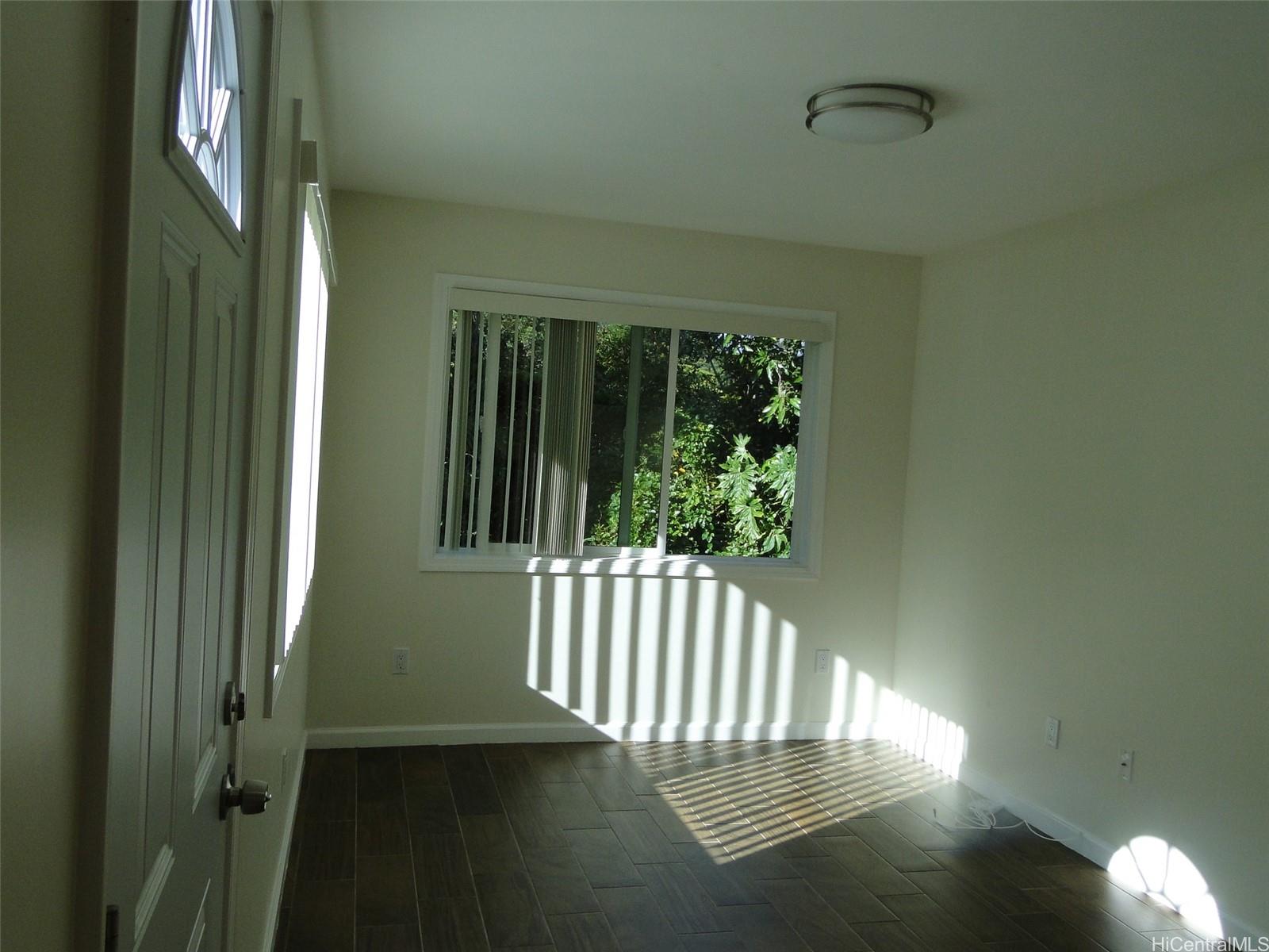 a view of porch with wooden floor