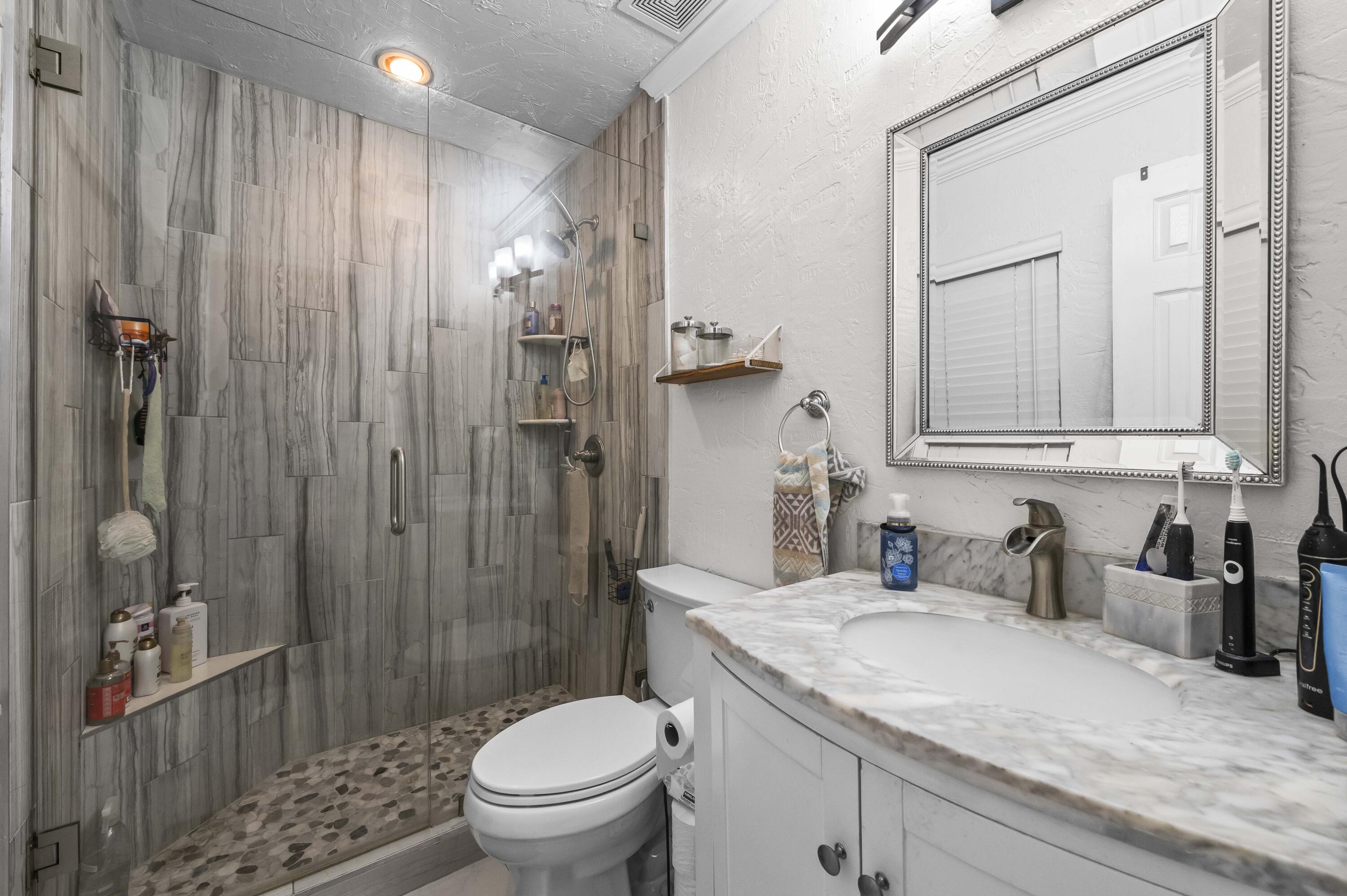 6427 Travis Road Lake Clarke Shores, FL 33406 - Photo 23 of 32 16 Bathroom 01