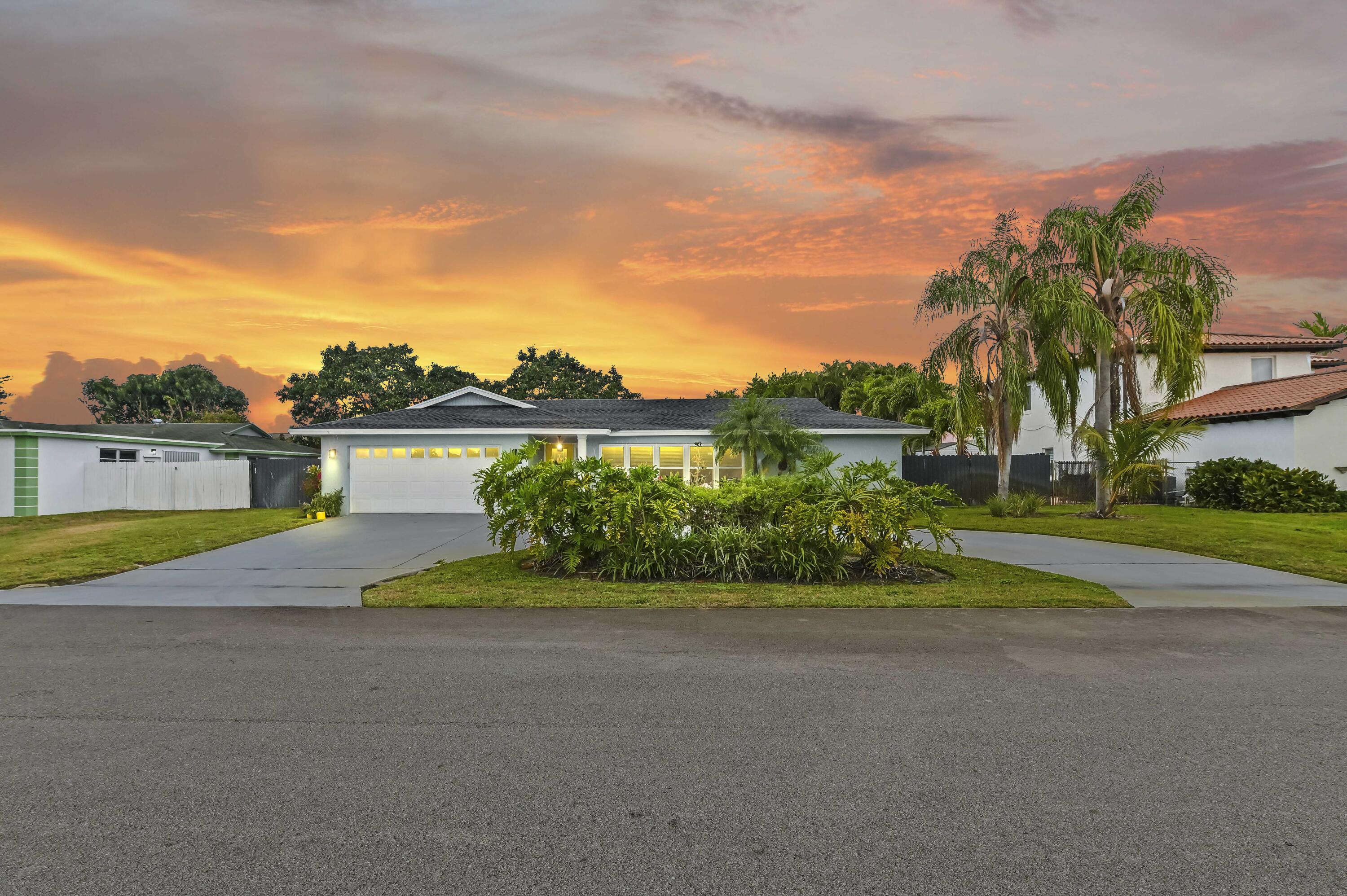 6427 Travis Road Lake Clarke Shores, FL 33406 - Photo 32 of 32 68 twilight 01
