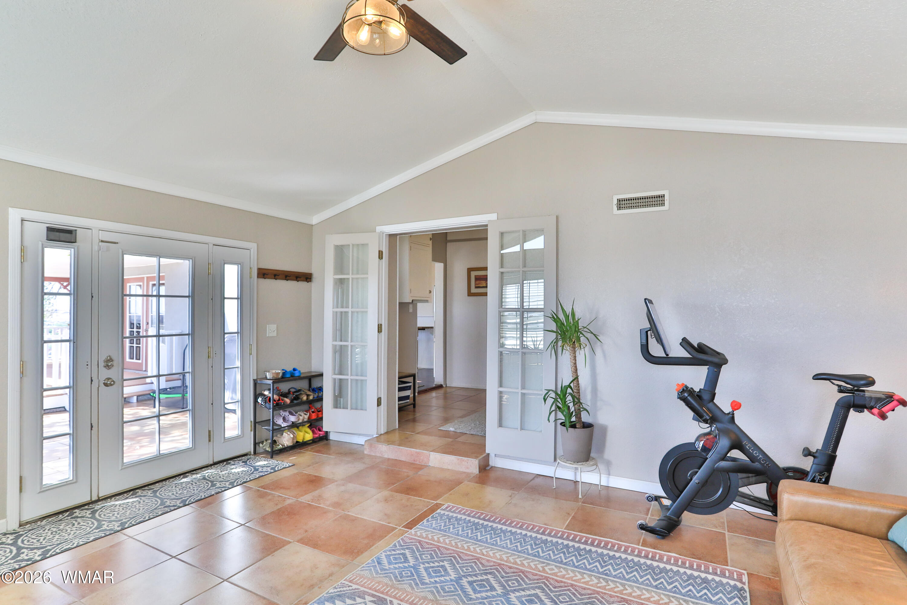 102 Crestview Road Holbrook, AZ 86025 - Photo 8 of 55 a view of a livingroom with gym equipment