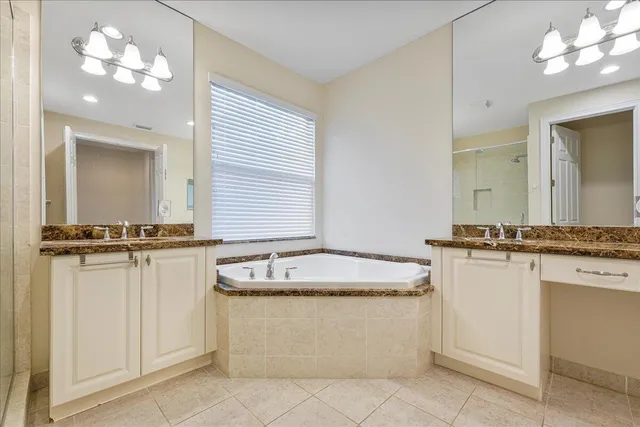 a bathroom with a granite countertop sink a mirror and a
