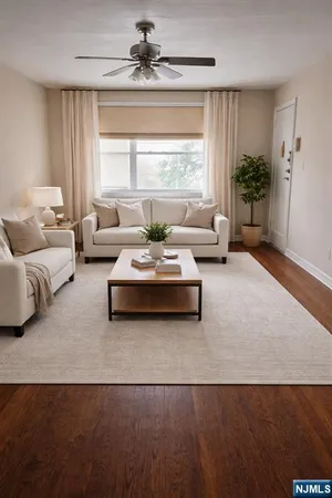 a living room with furniture and window
