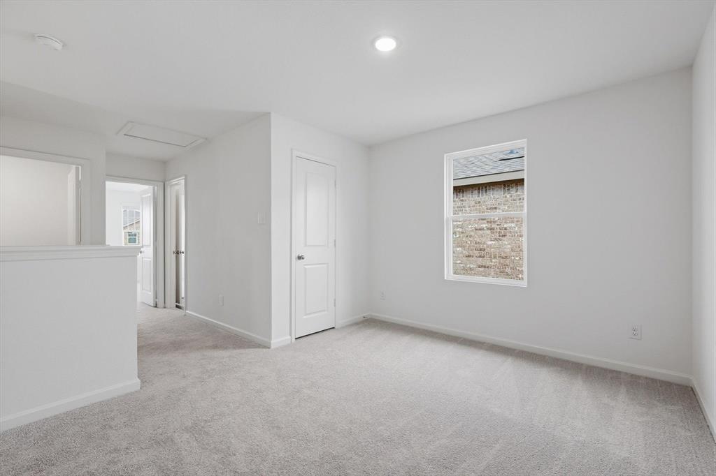 2018 Prairie Lane Melissa, TX 75454 - Photo 18 of 40 an empty room with windows and closet