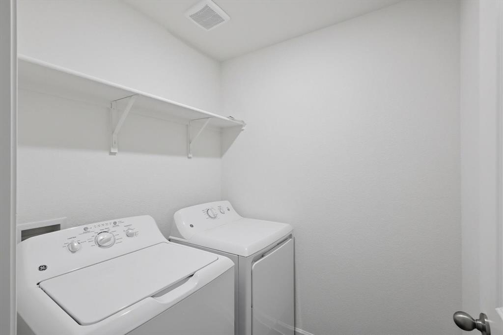 2018 Prairie Lane Melissa, TX 75454 - Photo 19 of 40 a utility room with dryer and washer