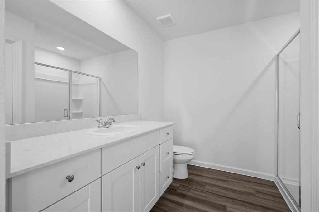 2018 Prairie Lane Melissa, TX 75454 - Photo 29 of 40 a bathroom with a granite countertop sink and a mirror