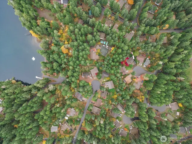 a backyard of a house with lots of green space and garden