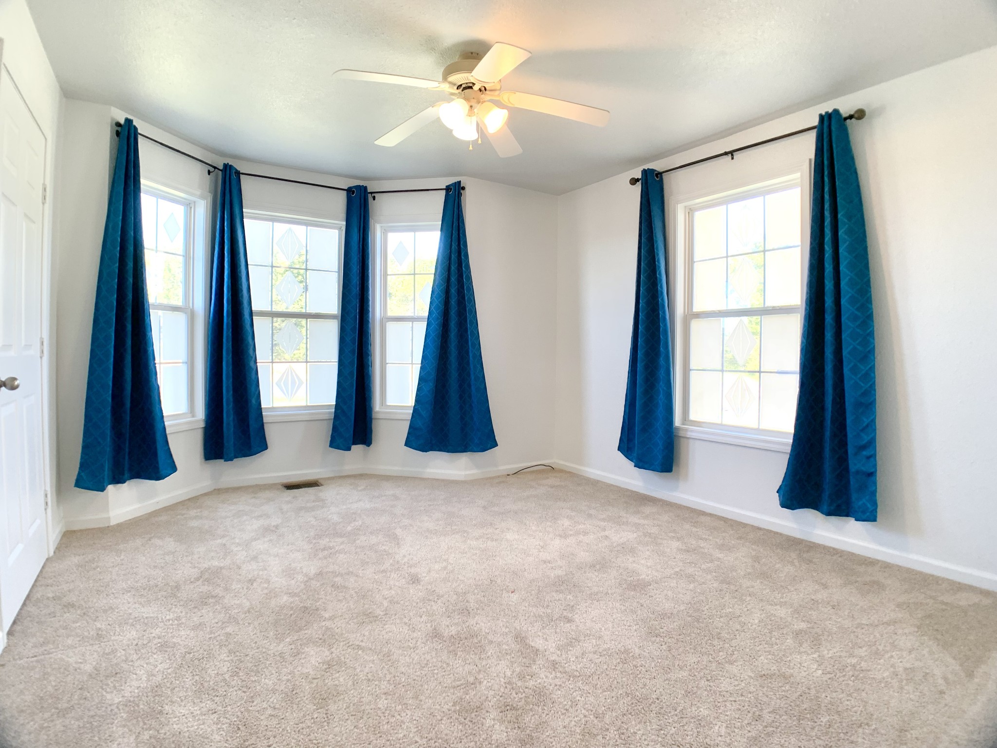 10543 Bell Station Road Oak Grove, KY 42262 - Photo 20 of 41 an empty room with windows and fan