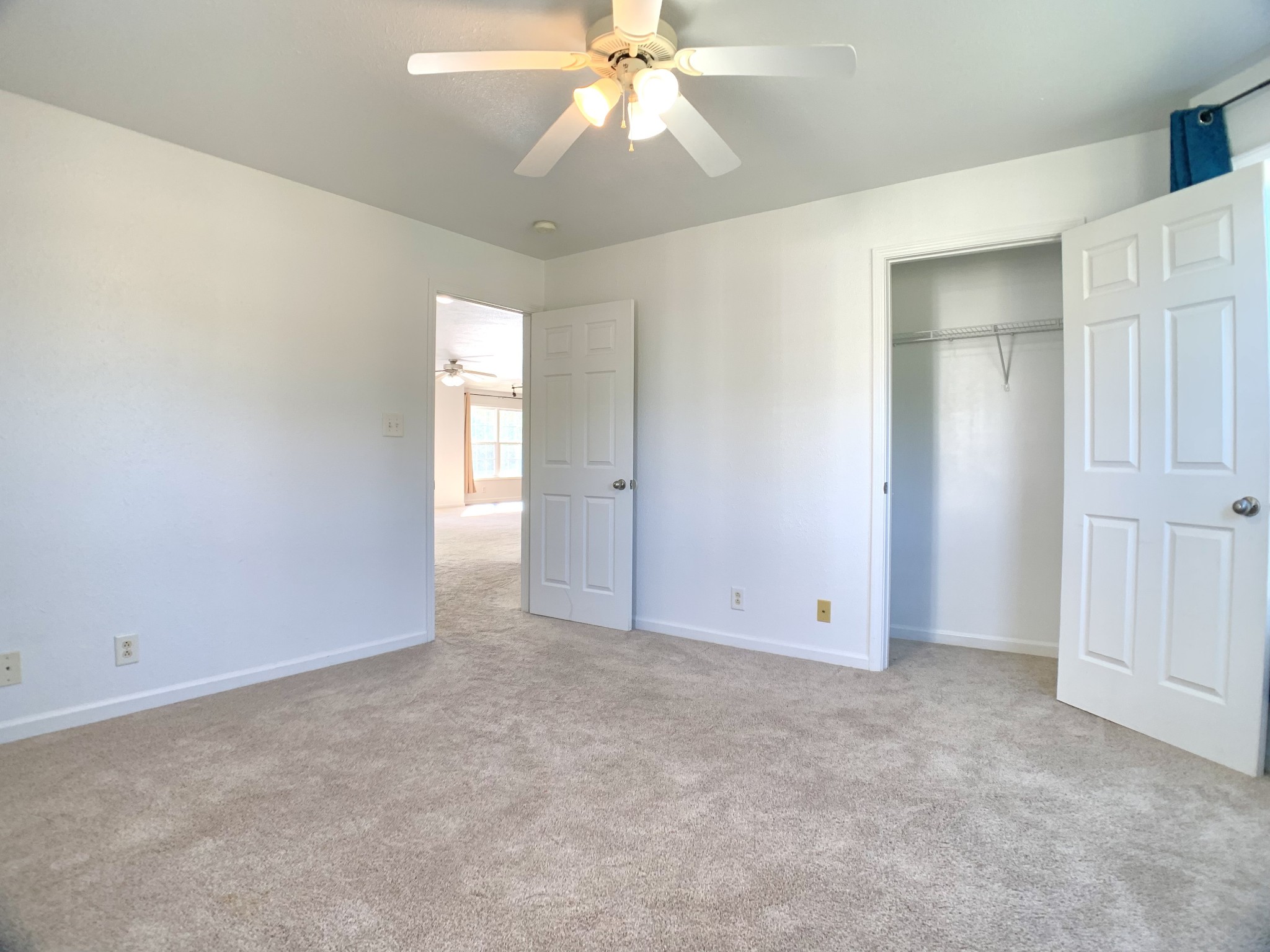10543 Bell Station Road Oak Grove, KY 42262 - Photo 22 of 41 an empty room with chandelier fan and windows