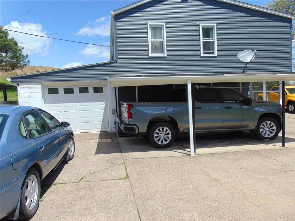 5569 Aiken Road McKees Rocks, PA 15136 - Photo 3 of 24 a car parked in front of a building