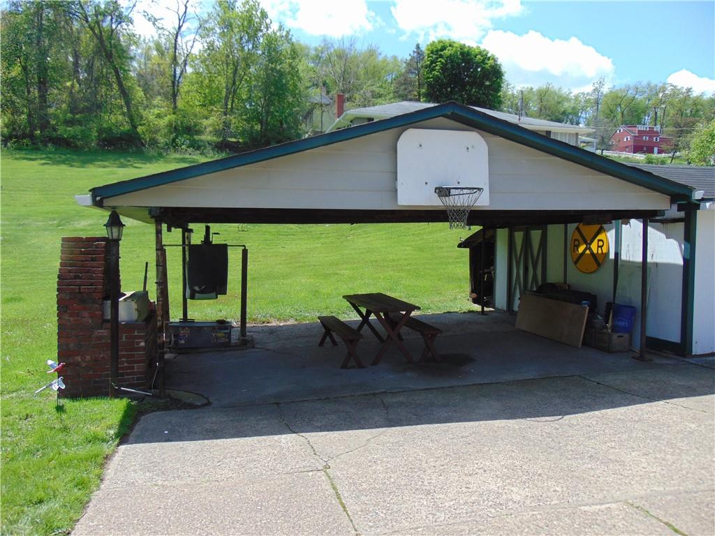 5569 Aiken Road McKees Rocks, PA 15136 - Photo 4 of 24 a house view with a garden space