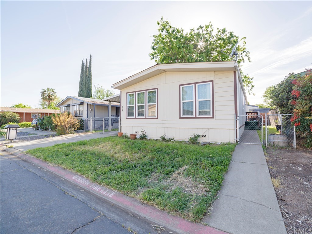 3549 Bianca Way, Unit 126 Chico, CA 95973 - Photo 1 of 1 a view of a house with a backyard