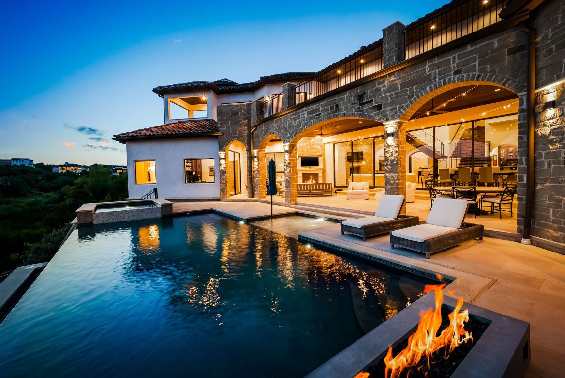 a swimming pool view with a outdoor seating