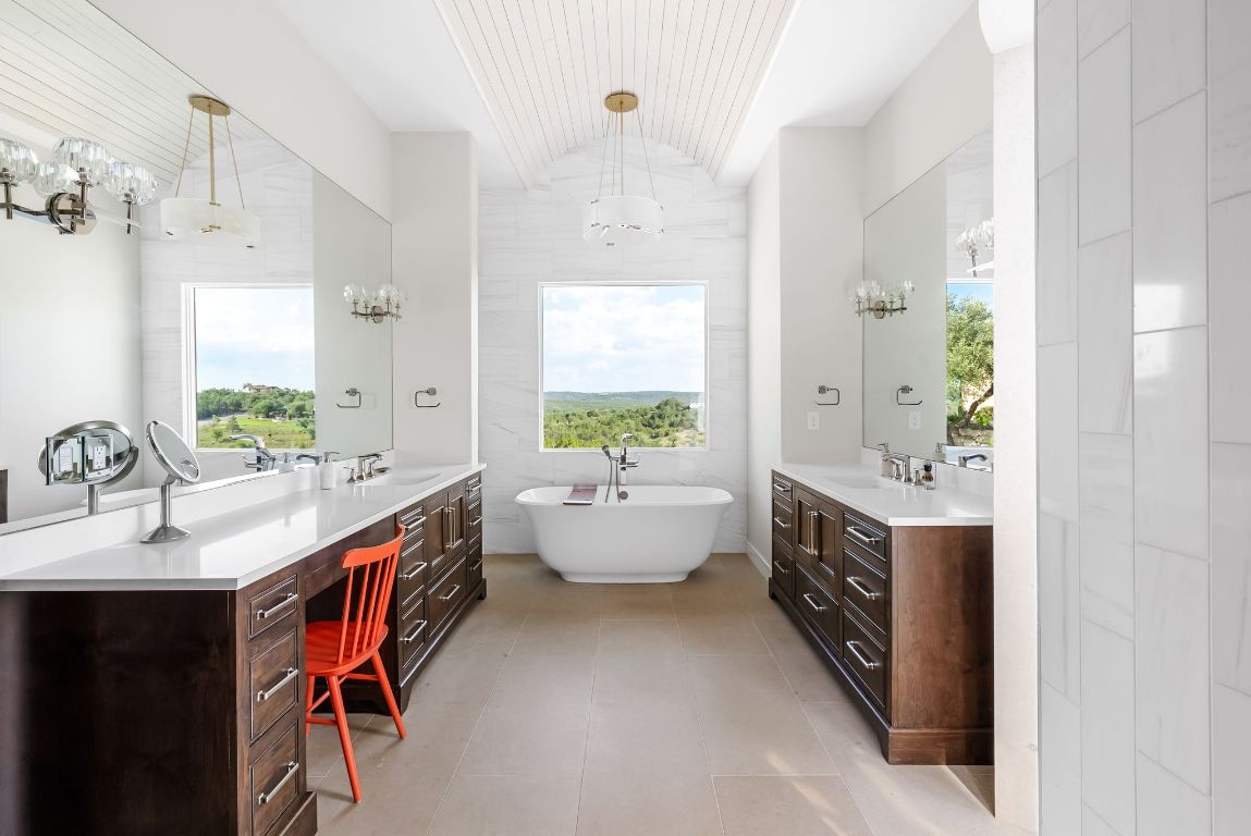12109 Musket Rim Street Austin, TX 78738 - Photo 17 of 38 a spacious bathroom with a double vanity sink mirror and a bathtub