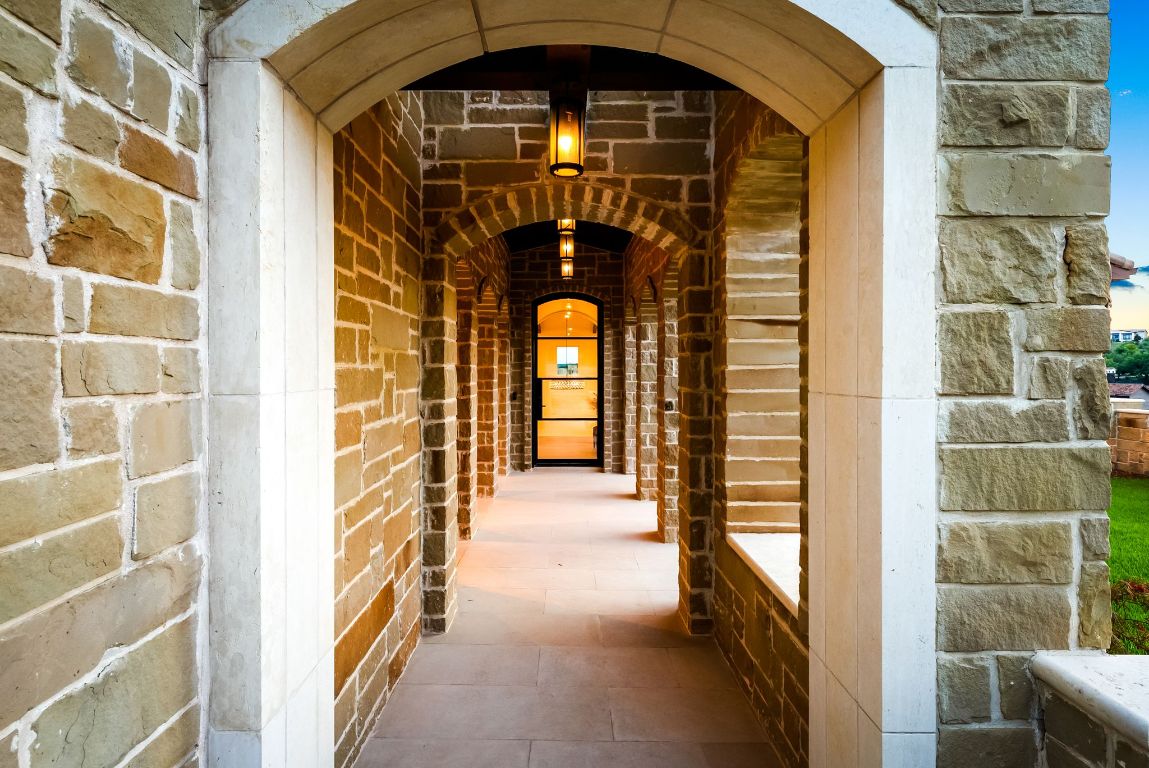 12109 Musket Rim Street Austin, TX 78738 - Photo 34 of 38 a front view of a house with a glass door