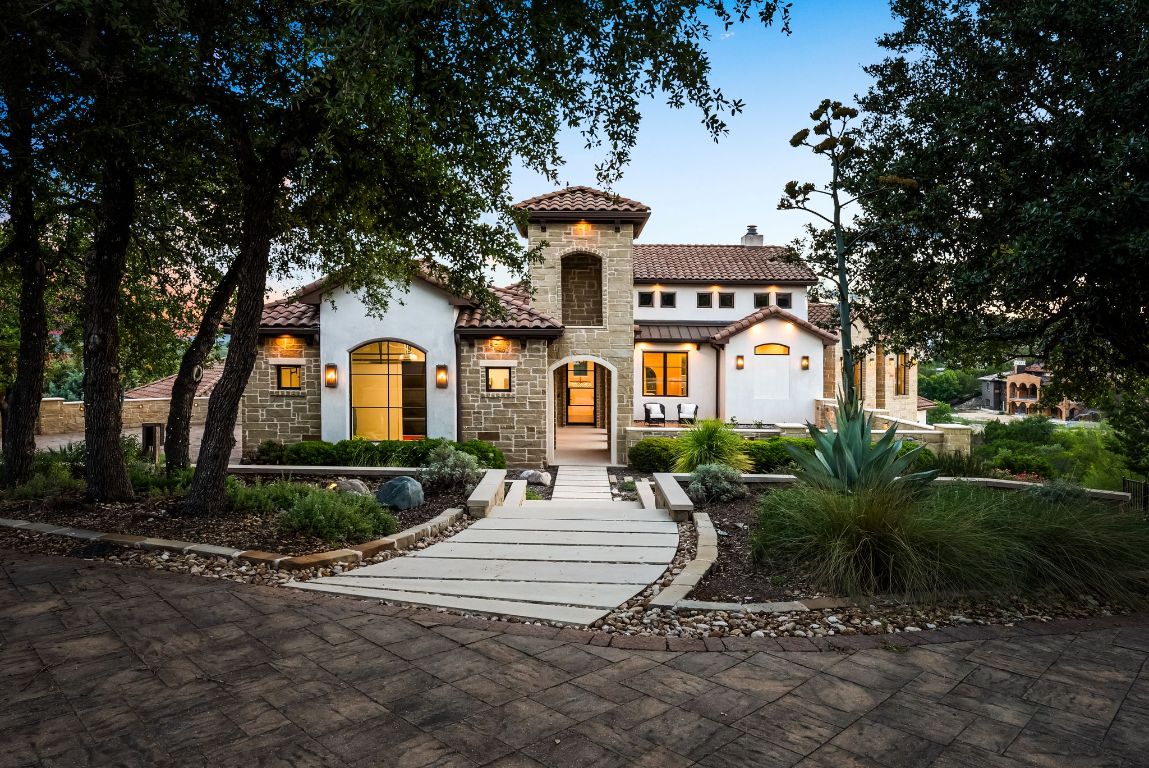 12109 Musket Rim Street Austin, TX 78738 - Photo 4 of 38 a front view of a house with garden