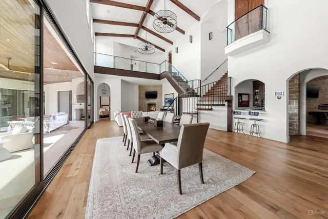 a view of a dining room with furniture wooden floor and a rug