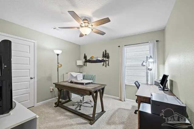 a workspace with furniture and window