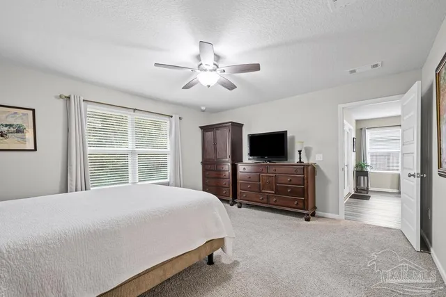 a bedroom with a bed and a television in it
