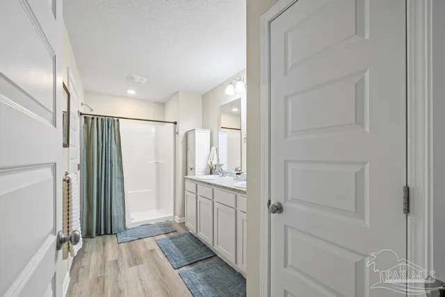a view of a hallway with a chandelier