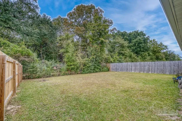 a view of swimming pool with a yard and mountain view