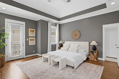 a bathroom with a granite countertop sink a toilet and bathtub