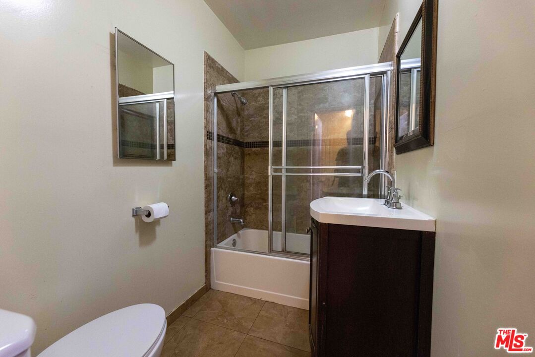 947 South Westmoreland Avenue, Unit 310 Los Angeles, CA 90006 - Photo 6 of 17 a bathroom with a sink toilet and shower