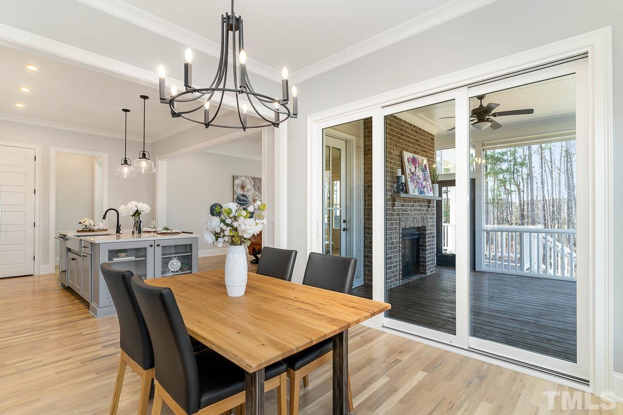 737 Daniel Rdg Road Wendell, NC 27591 - Photo 6 of 12 Kitchen and dining area flows right into the screened in porch