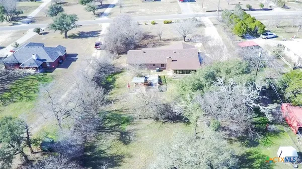 an aerial view of residential house with outdoor space