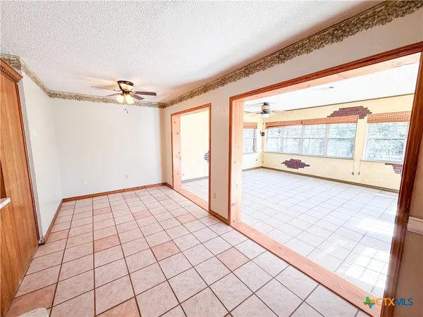 a view of an empty room and window