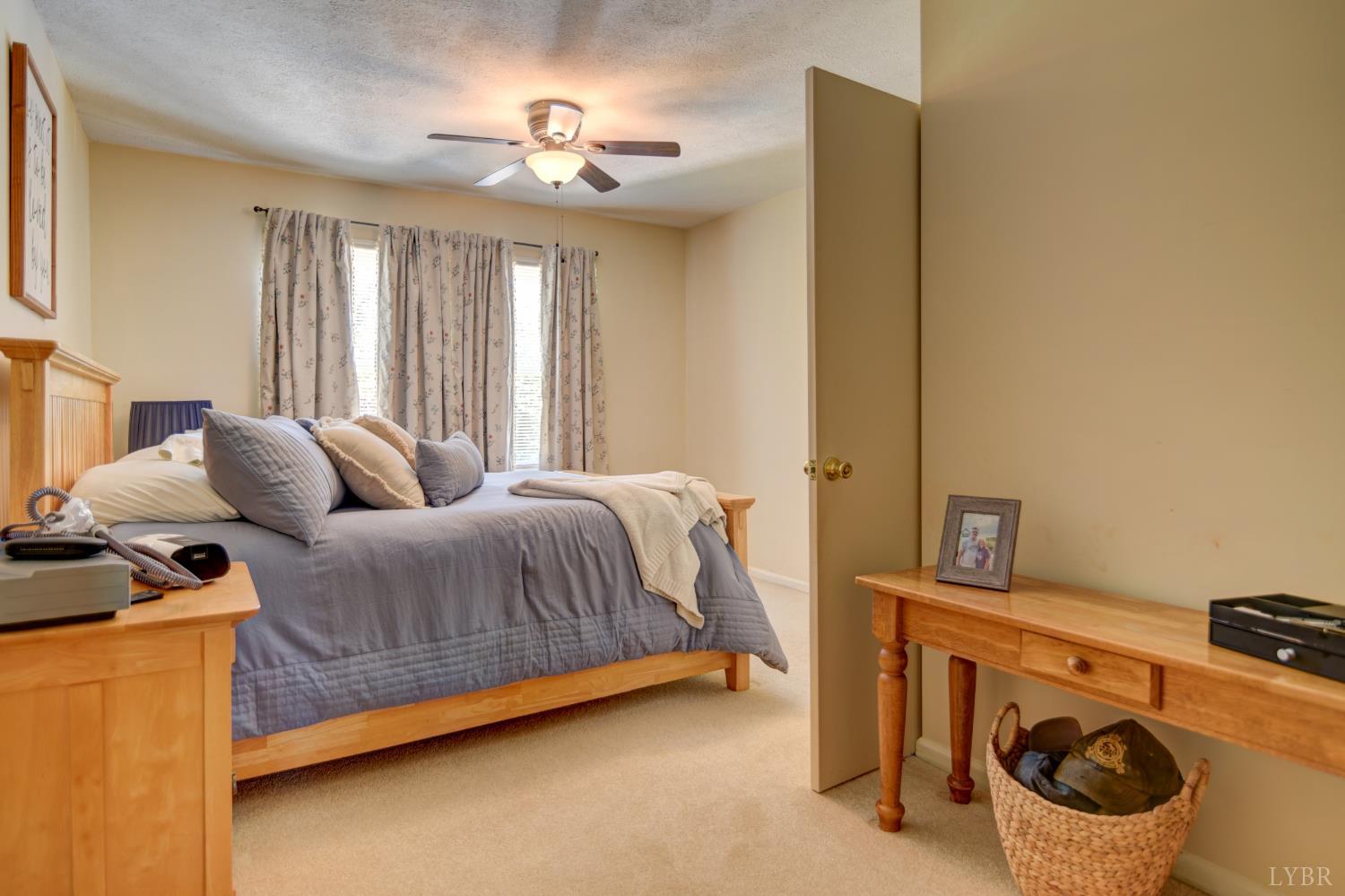 151 Anderson Place Rustburg, VA 24588 - Photo 18 of 57 Primary bedroom with added seating, make-up or reading nook.