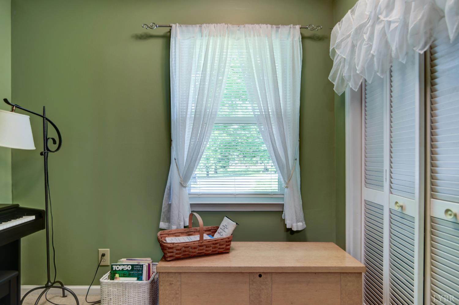 151 Anderson Place Rustburg, VA 24588 - Photo 22 of 57 a bathroom with a window and a shower