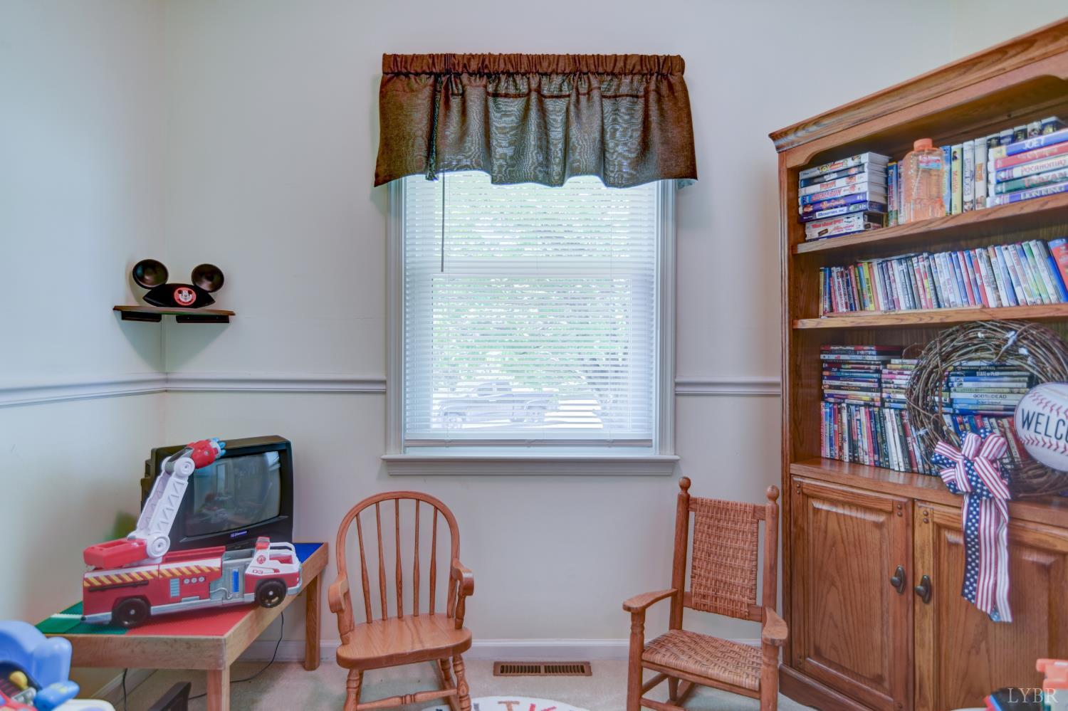 151 Anderson Place Rustburg, VA 24588 - Photo 25 of 57 a view of a workspace with furniture and a book shelf
