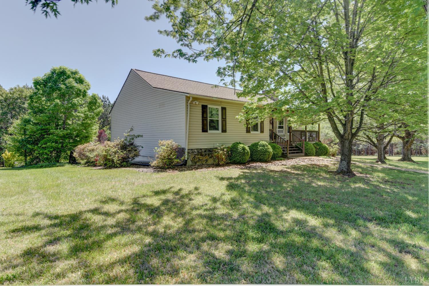 151 Anderson Place Rustburg, VA 24588 - Photo 45 of 57 a backyard of a house with potted plants and large tree