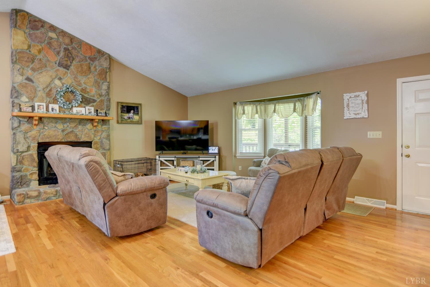 151 Anderson Place Rustburg, VA 24588 - Photo 5 of 57 a living room with furniture and a flat screen tv