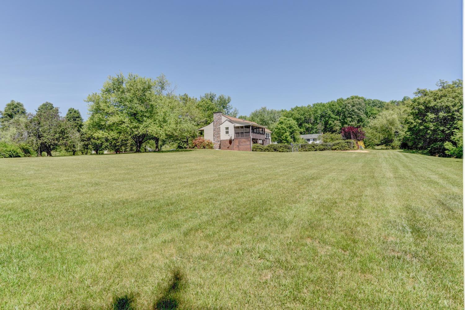 151 Anderson Place Rustburg, VA 24588 - Photo 50 of 57 a view of a big yard with plants and large trees
