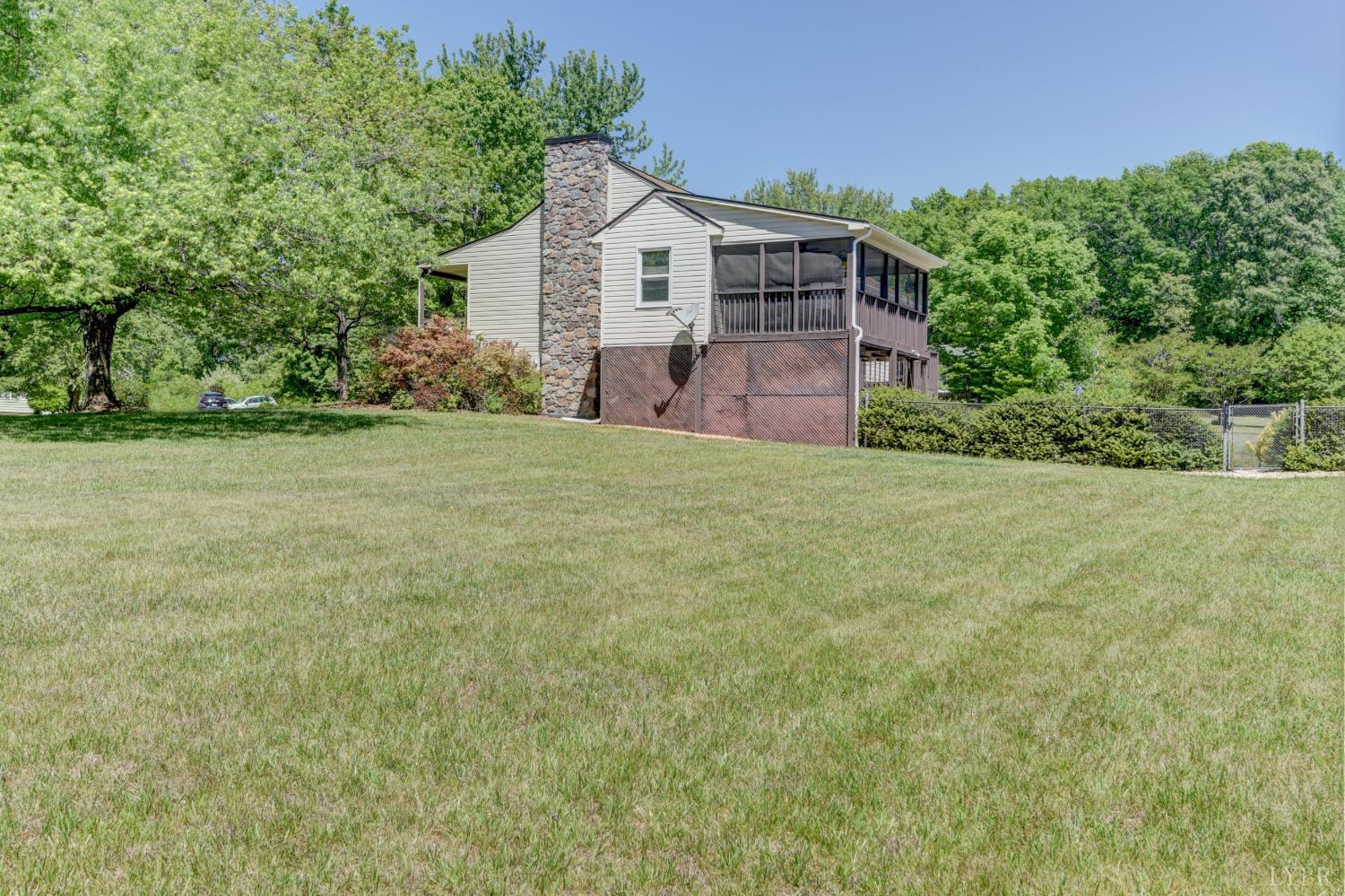 151 Anderson Place Rustburg, VA 24588 - Photo 51 of 57 a view of a house with a yard and potted plants
