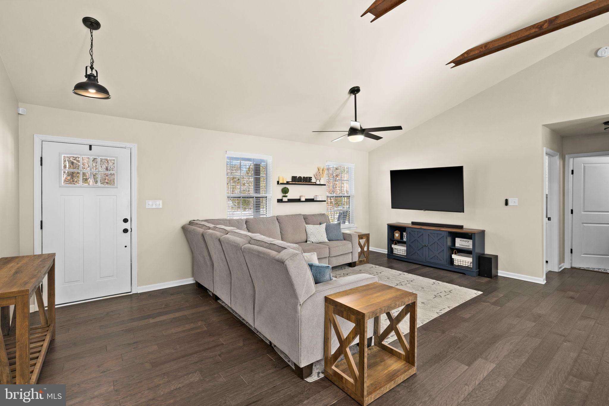 5269 Macedonia Road Woodford, VA 22580 - Photo 13 of 37 a living room with furniture and a flat screen tv