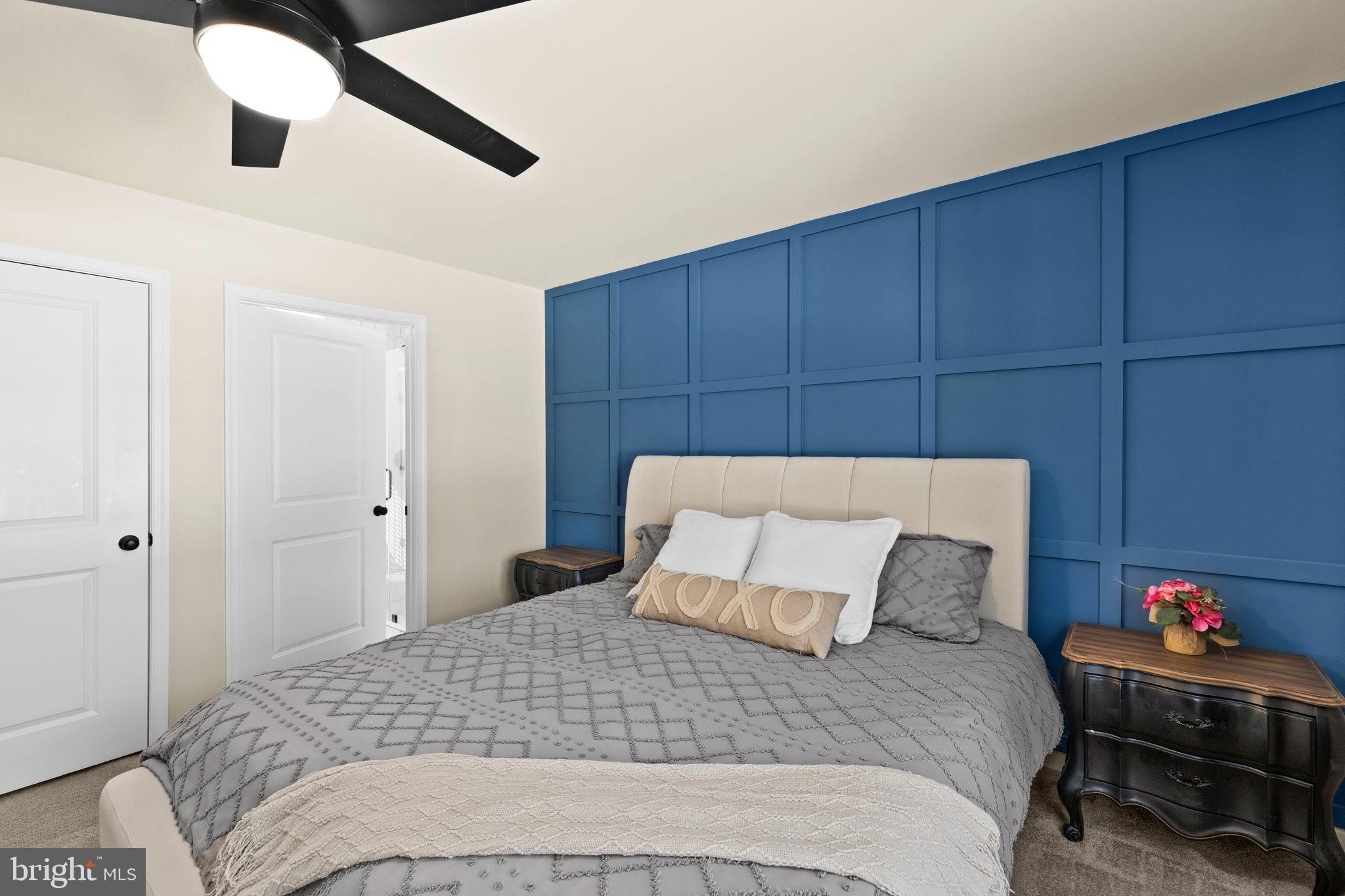 5269 Macedonia Road Woodford, VA 22580 - Photo 16 of 37 a bedroom with a bed and a chandelier