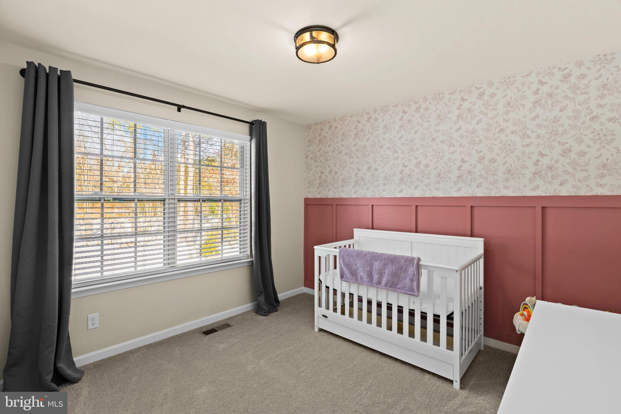 5269 Macedonia Road Woodford, VA 22580 - Photo 21 of 37 a bedroom with a bed and a window