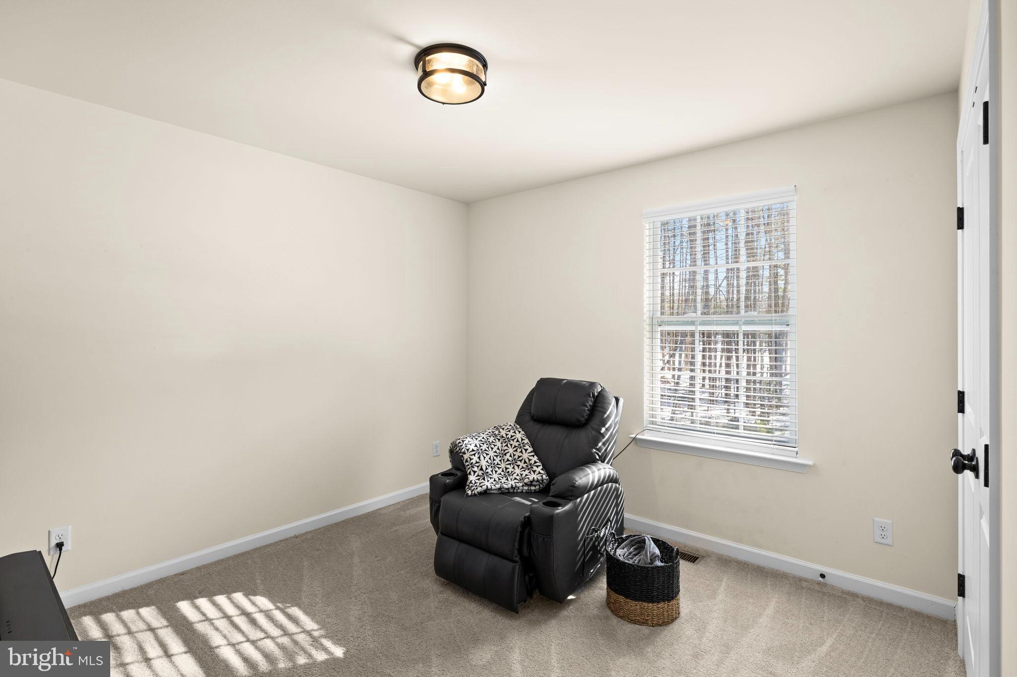 5269 Macedonia Road Woodford, VA 22580 - Photo 23 of 37 a room with furniture and a window