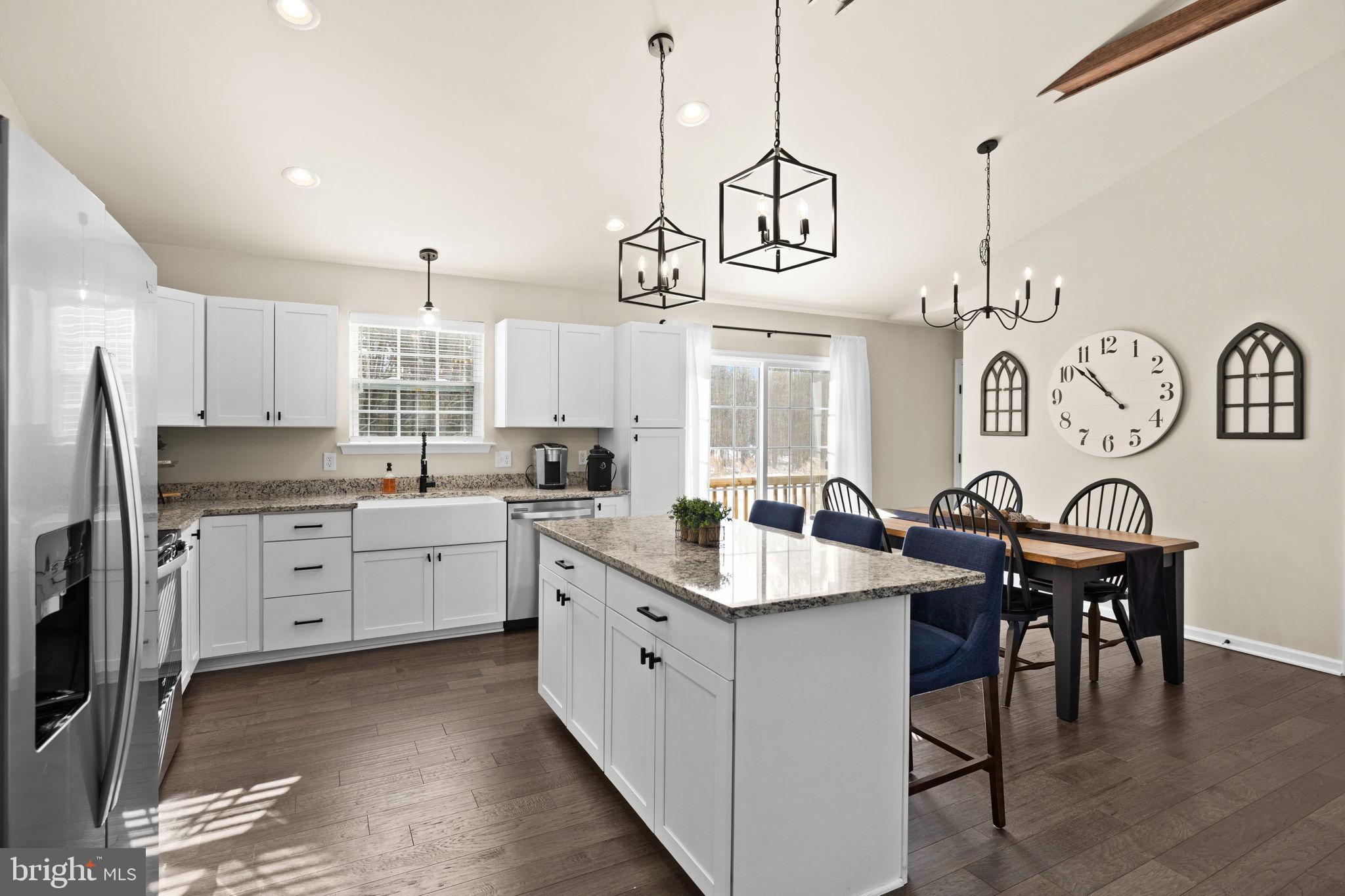 5269 Macedonia Road Woodford, VA 22580 - Photo 5 of 37 a kitchen with center island table and chairs