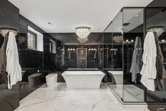 a bedroom with furniture and a lamp