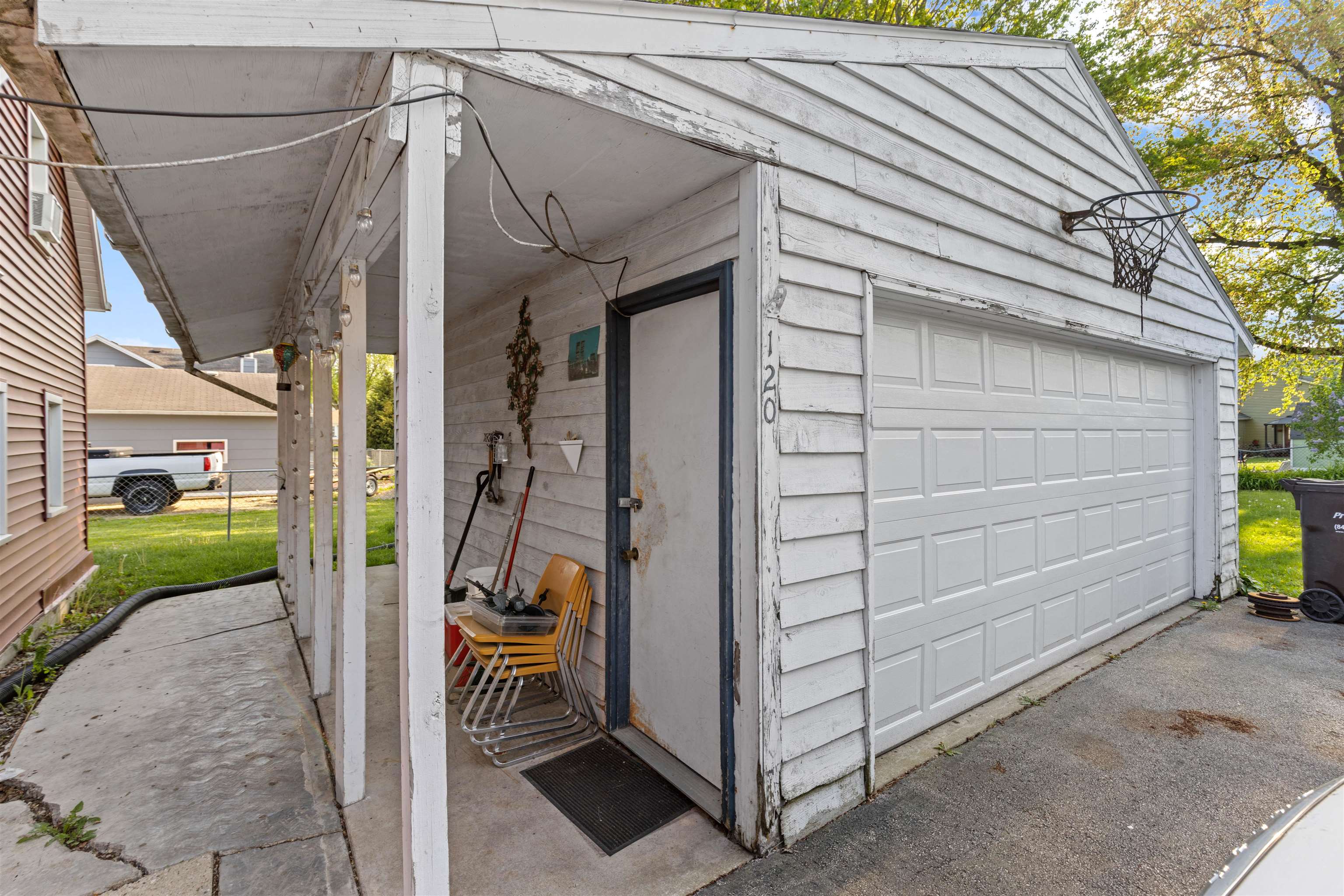 120 5th Street Capron, IL 61012 - Photo 12 of 13 a view of a house with a door and a window