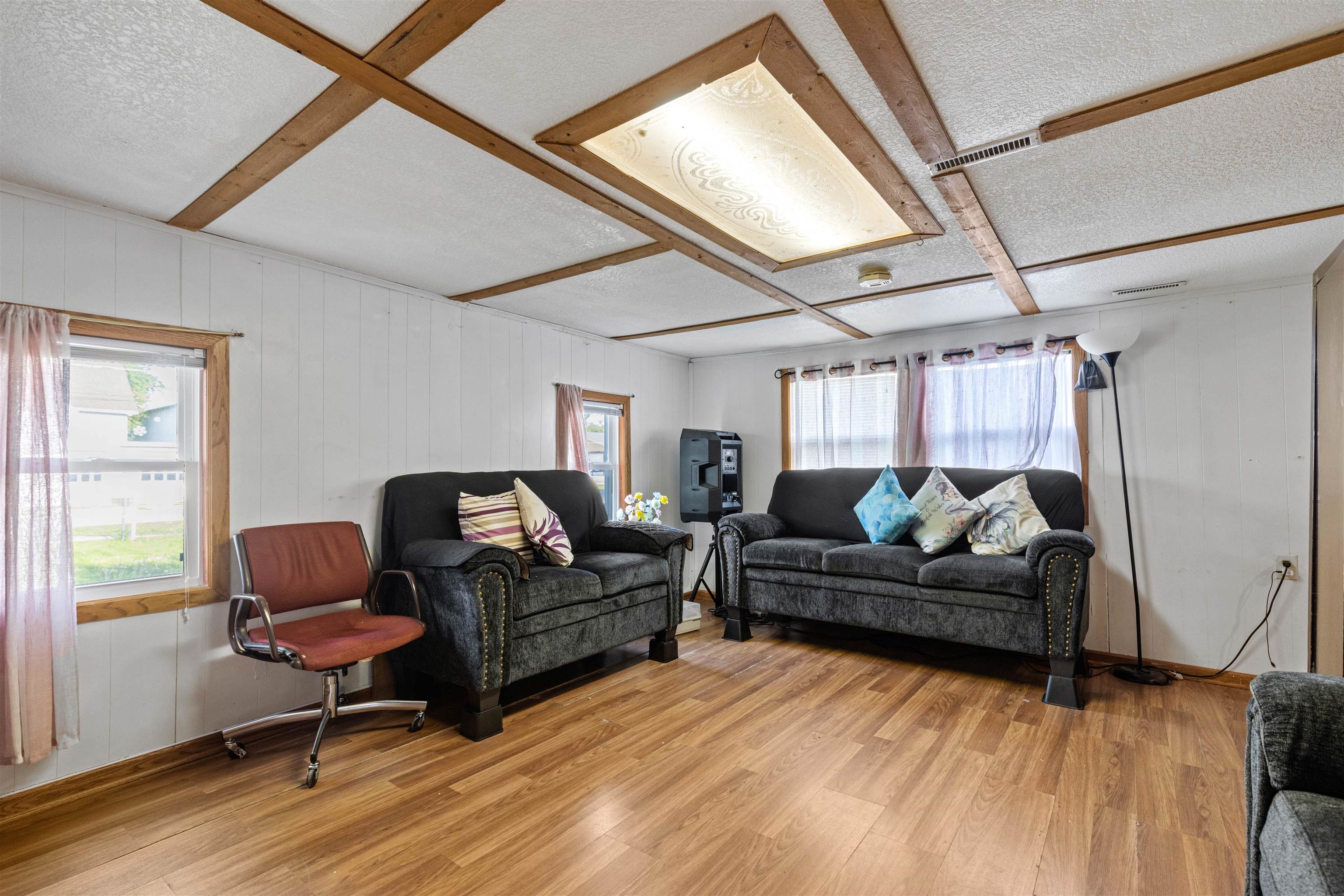 120 5th Street Capron, IL 61012 - Photo 2 of 13 a living room with furniture and a window