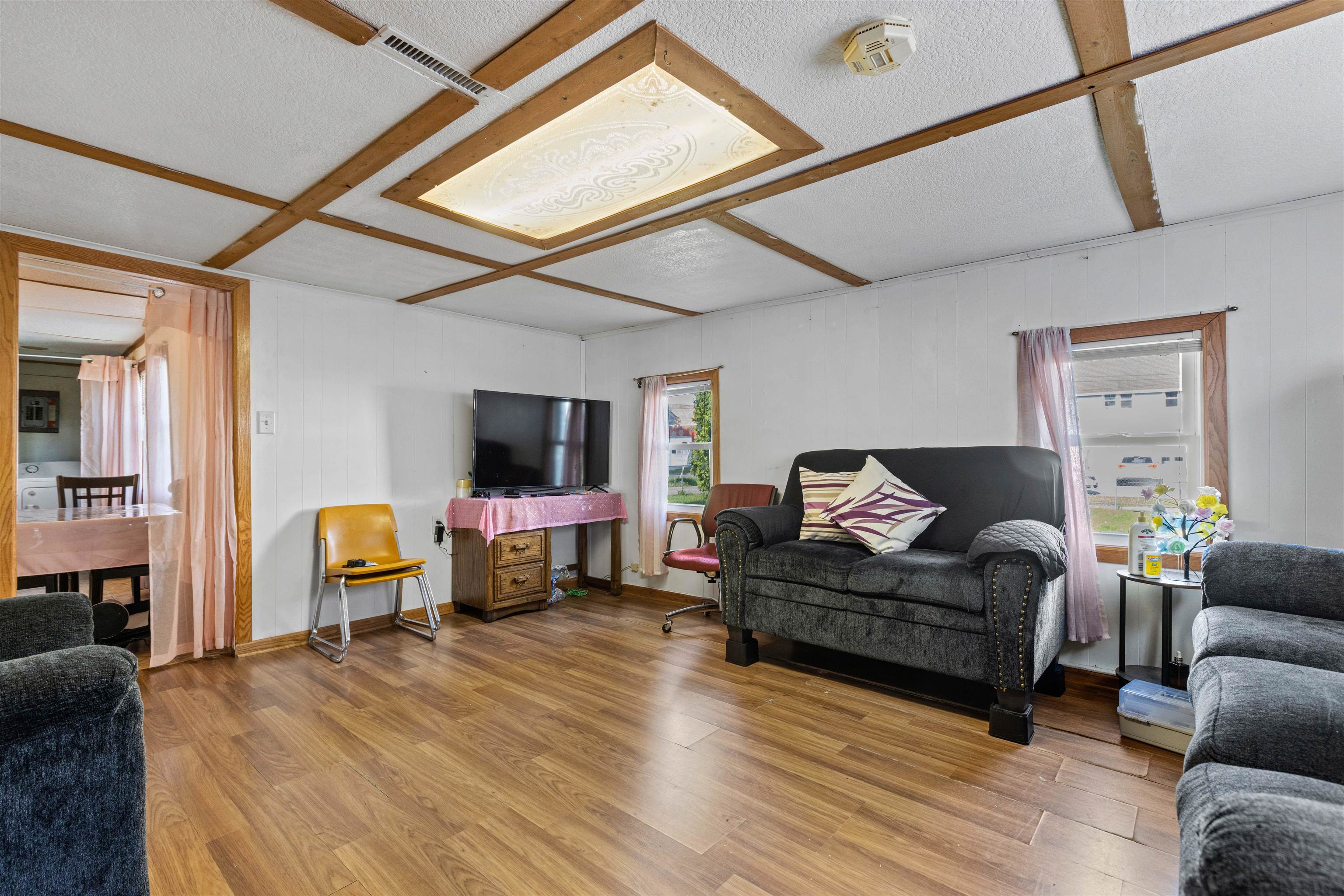 120 5th Street Capron, IL 61012 - Photo 3 of 13 a living room with furniture and a flat screen tv