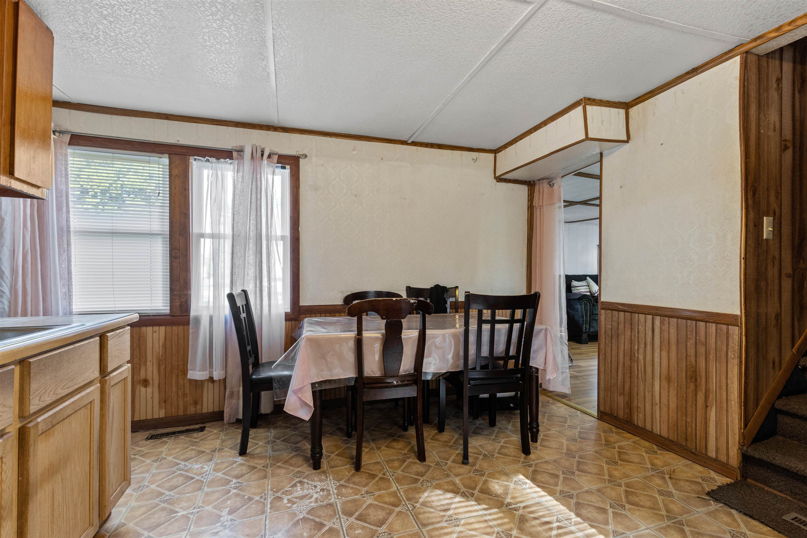 120 5th Street Capron, IL 61012 - Photo 6 of 13 a view of a dining room with furniture window and wooden floor