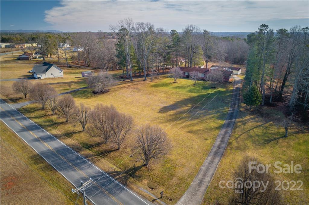 7680 Rhodhiss Road Connelly Springs, NC 28612 - Photo 21 of 25 a view of a swimming pool with an outdoor seating