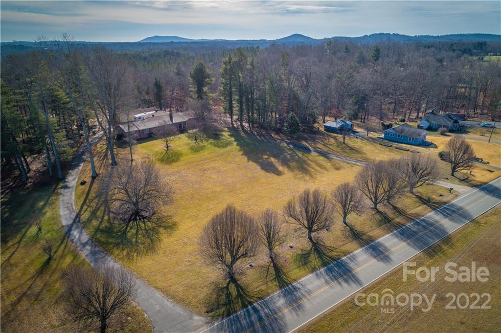 7680 Rhodhiss Road Connelly Springs, NC 28612 - Photo 22 of 25 a view of swimming pool with a yard