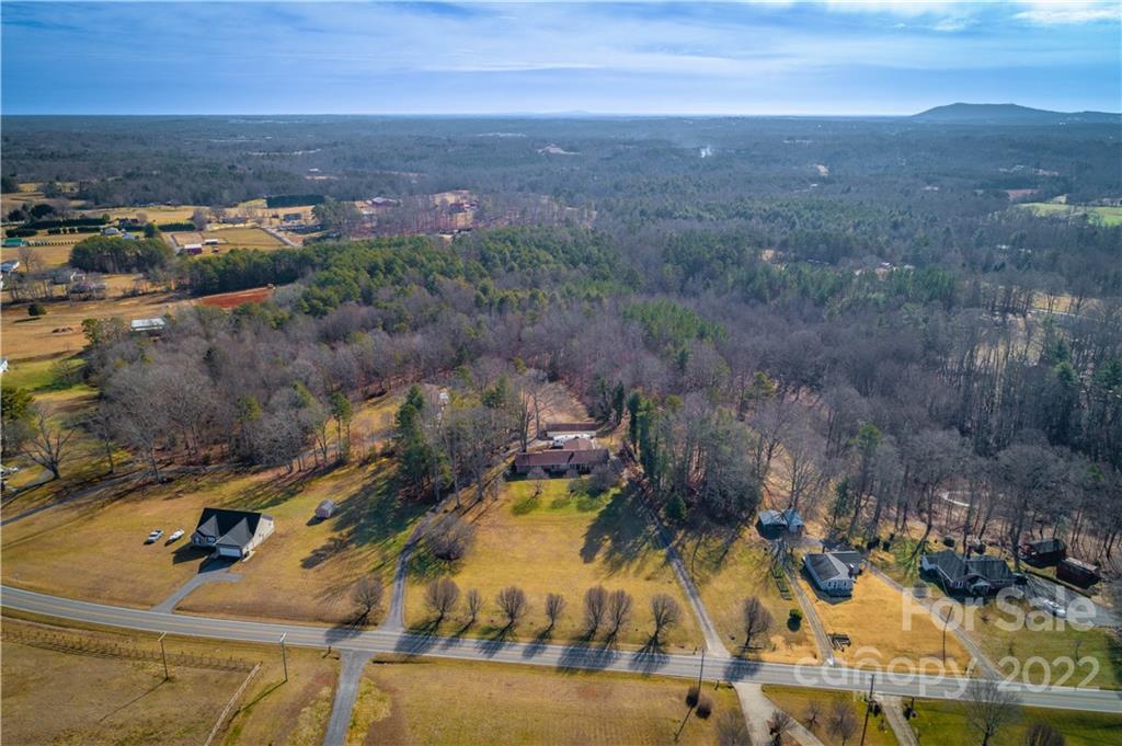 7680 Rhodhiss Road Connelly Springs, NC 28612 - Photo 24 of 25 an aerial view of residential houses with outdoor space