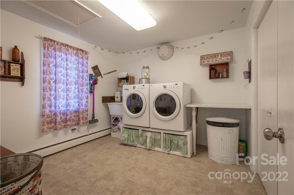7680 Rhodhiss Road Connelly Springs, NC 28612 - Photo 10 of 25 a utility room with dryer and washer